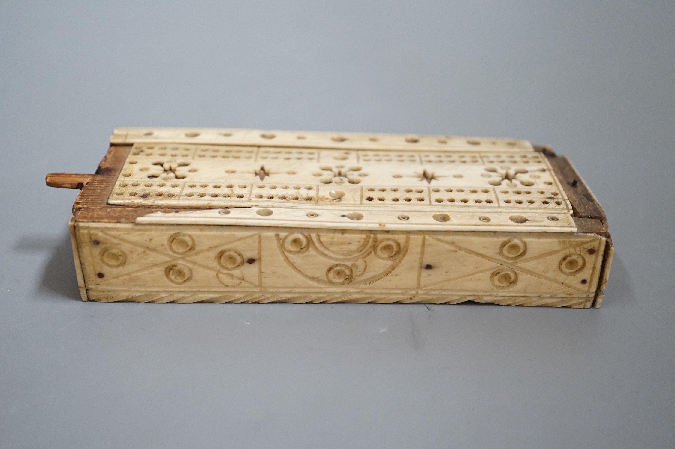 A Napoleonic Prisoner of War bone domino set, box 14cm wide